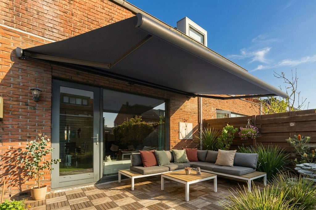 Awning shading an outdoor lounge on a brick home